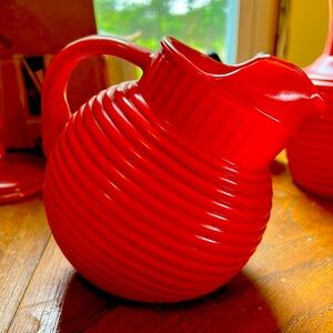 Anchor hocking vintage bright orange pitcher tilted.